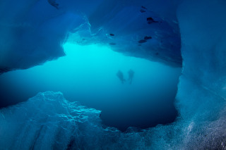 looking-out-of-cave-w-2-divers